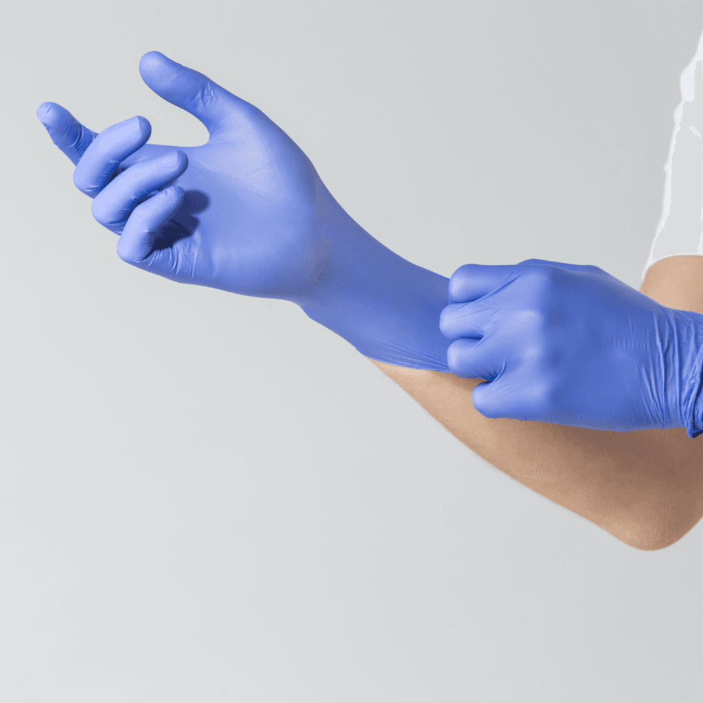 Hände mit chirurgischen Handschuhen